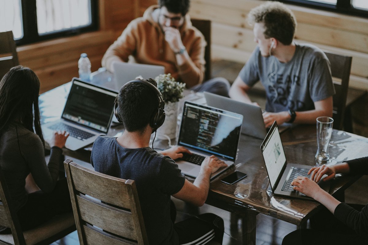 A group of people working together at a laptop