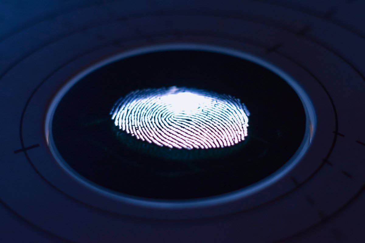 A glowing fingerprint on a scanner