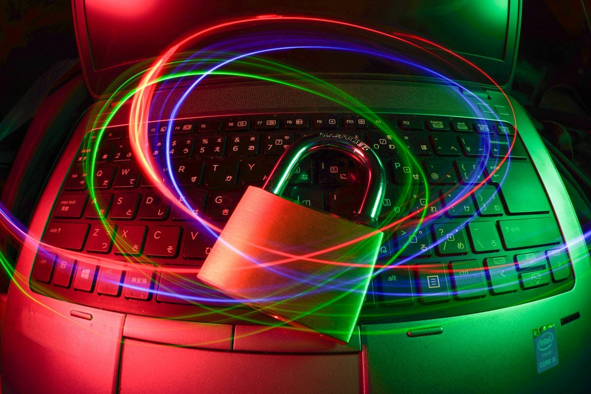 A padlock on a laptop with light trails