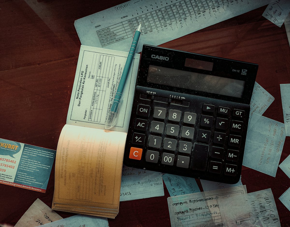A calculator on a wooden table