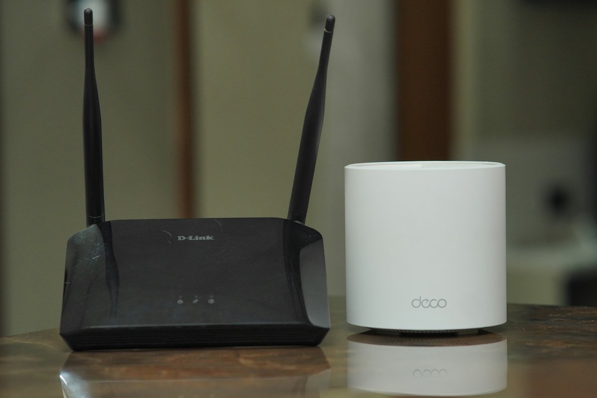 A couple of routers sitting on top of a table