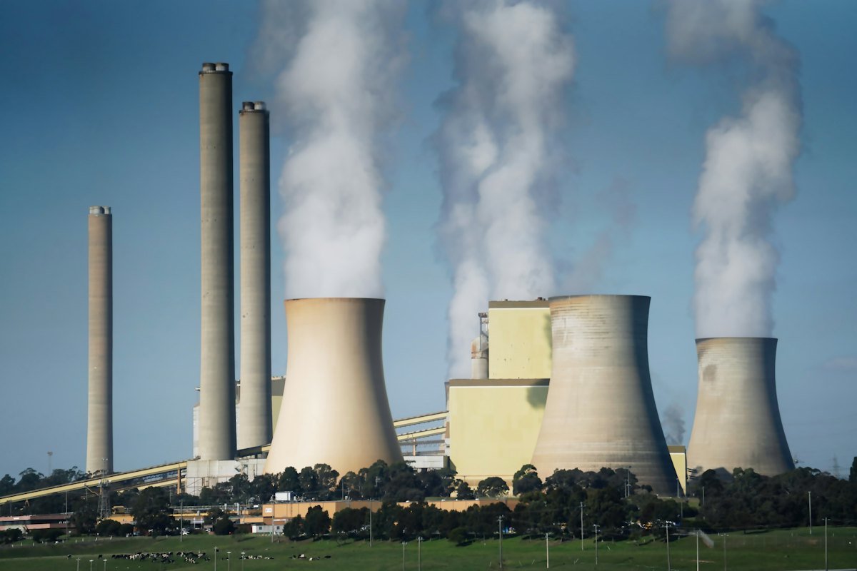 Steam rising from the cooling towers of a power plant