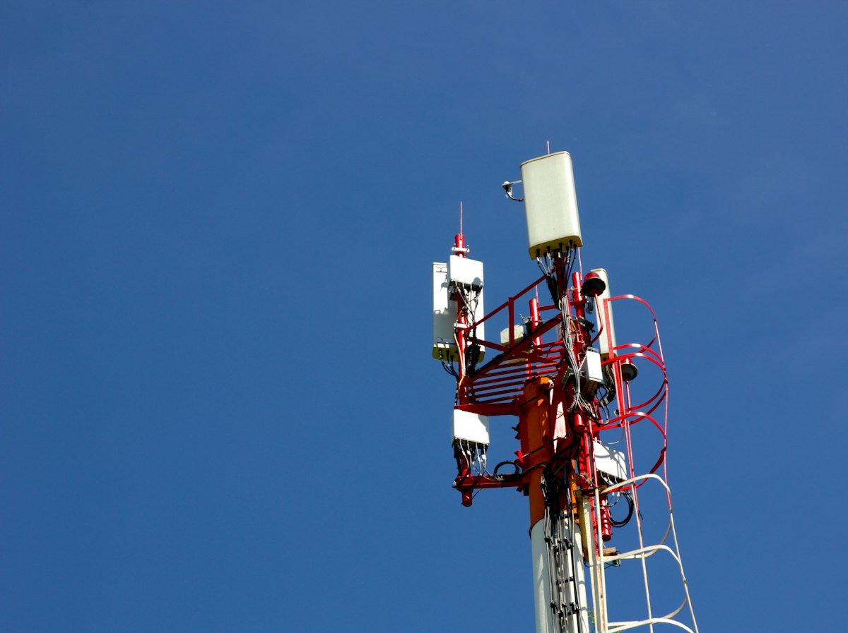 A cell tower against a blue sky