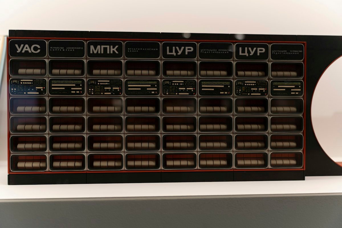 A rack of electronic components with labels