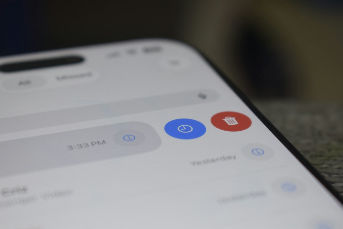 A smartphone screen displaying a list of notifications with blue and red icons